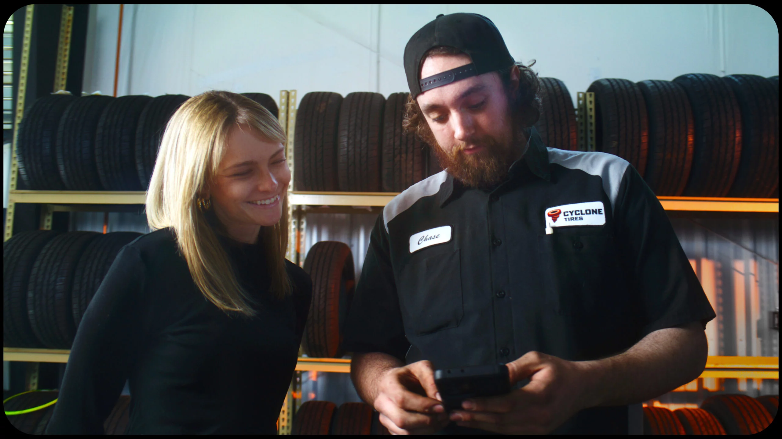 Cyclone Tires technician helping a customer with tire repair and new tire installation in Pueblo West, Colorado.
